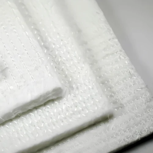 Stitch-Bonded Fiberglass Needle Mat_WH_800x800px Stitch-bonded fiberglass needle mat is a high-performance thermal insulation material designed forextremetemperature environments. Manufactured by mechanically interlocking glass fibers through a needingandstitching process, this mat offers exceptional durability, flexibility, and resistance to high temperatures. it is widely usedin industrial insulation, automotive thermal management, and fire protection applications.